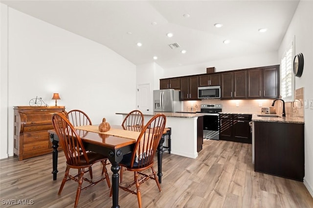 6667 Estero Bay Dr, Fort Myers, FL 33908 - dining space with recessed lighting, light wood-style floors, lofted ceiling, and visible vents