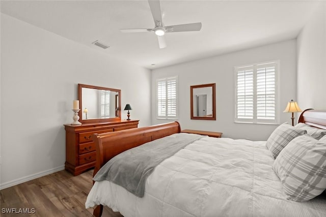 6667 Estero Bay Dr, Fort Myers, FL 33908 - bedroom featuring baseboards, ceiling fan, visible vents, and wood finished floors