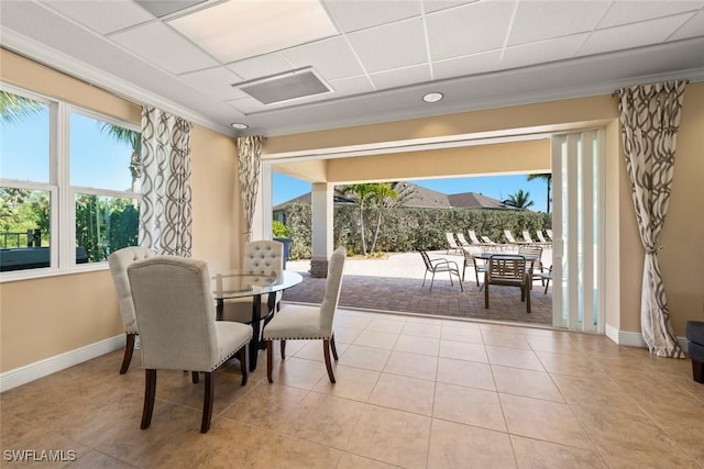 6667 Estero Bay Dr, Fort Myers, FL 33908 - tiled dining area featuring a drop ceiling, ornamental molding, baseboards, and visible vents