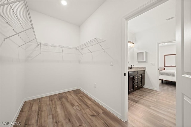 6667 Estero Bay Dr, Fort Myers, FL 33908 - walk in closet with a sink, visible vents, and light wood-style flooring