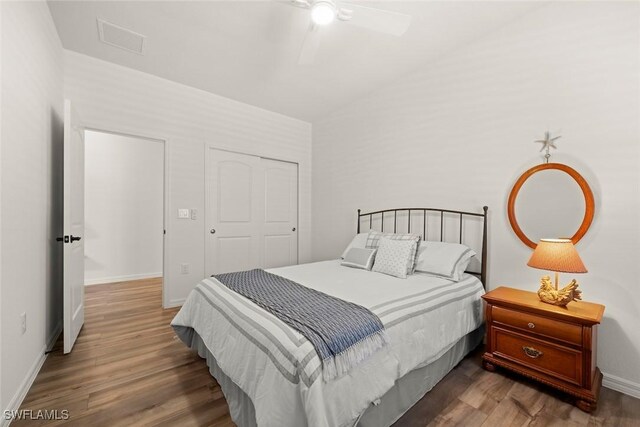 6667 Estero Bay Dr, Fort Myers, FL 33908 - bedroom featuring baseboards, visible vents, wood finished floors, and vaulted ceiling