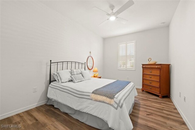 6667 Estero Bay Dr, Fort Myers, FL 33908 - bedroom featuring baseboards, wood finished floors, and ceiling fan