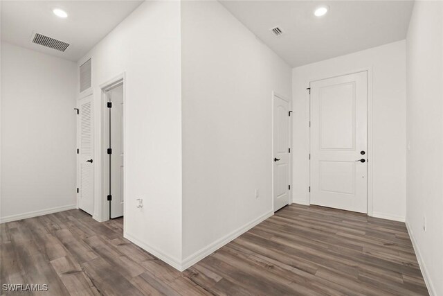 6667 Estero Bay Dr, Fort Myers, FL 33908 - corridor featuring baseboards, visible vents, wood finished floors, and recessed lighting