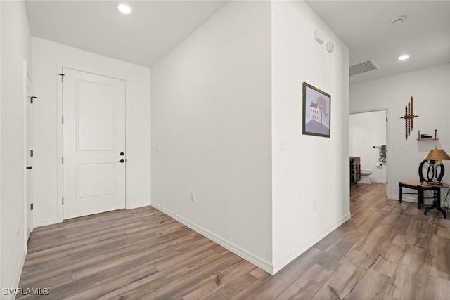 6667 Estero Bay Dr, Fort Myers, FL 33908 - hall featuring baseboards, visible vents, wood finished floors, and recessed lighting