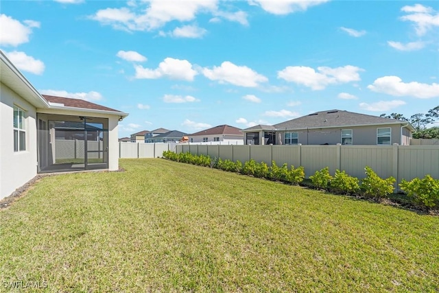 6667 Estero Bay Dr, Fort Myers, FL 33908 - view of yard with a residential view, a sunroom, and fence