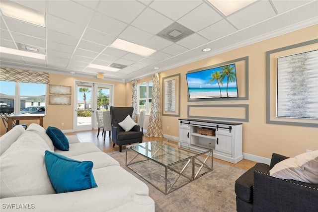 6667 Estero Bay Dr, Fort Myers, FL 33908 - living room featuring baseboards, ornamental molding, and a drop ceiling