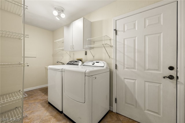 920 SW 4th Pl, Cape Coral, FL 33991 - washroom with washer and clothes dryer, light tile patterned floors, cabinet space, and baseboards