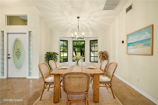920 SW 4th Pl, Cape Coral, FL 33991 - dining area featuring an inviting chandelier, baseboards, visible vents, and tile patterned floors
