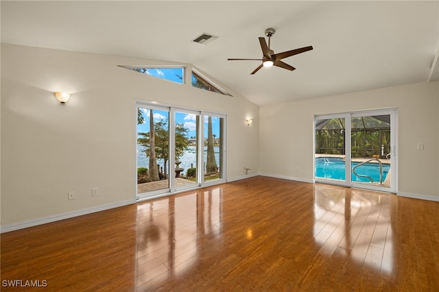 920 SW 4th Pl, Cape Coral, FL 33991 - unfurnished room featuring vaulted ceiling, wood finished floors, visible vents, and ceiling fan