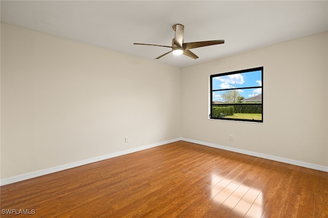 920 SW 4th Pl, Cape Coral, FL 33991 - unfurnished room with ceiling fan, baseboards, and wood finished floors