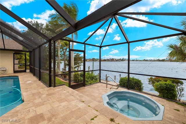 920 SW 4th Pl, Cape Coral, FL 33991 - outdoor pool featuring a patio area, an in ground hot tub, a lanai, and a water view