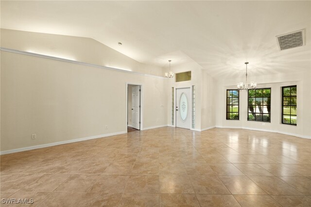 920 SW 4th Pl, Cape Coral, FL 33991 - empty room featuring a notable chandelier, visible vents, baseboards, and lofted ceiling