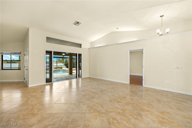 920 SW 4th Pl, Cape Coral, FL 33991 - spare room featuring visible vents, lofted ceiling, baseboards, and a chandelier