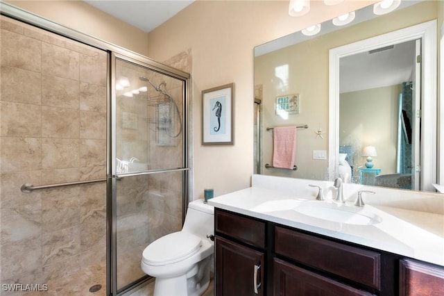 1621 Songbird Ct, Naples, FL 34120 - ensuite bathroom featuring vanity, a stall shower, and toilet