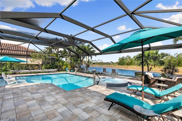 1621 Songbird Ct, Naples, FL 34120 - view of swimming pool featuring a patio area, a water view, a lanai, and a pool with connected hot tub