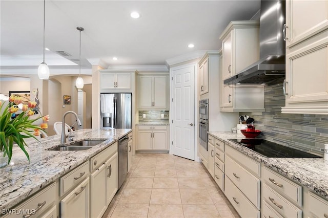 1621 Songbird Ct, Naples, FL 34120 - kitchen featuring appliances with stainless steel finishes, a sink, wall chimney range hood, decorative backsplash, and pendant lighting
