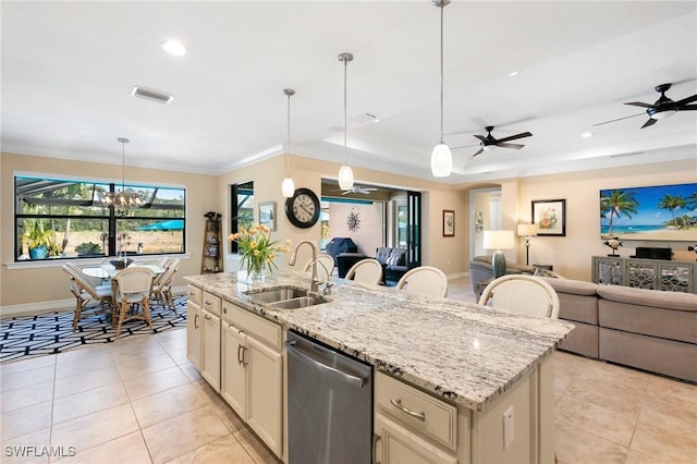 1621 Songbird Ct, Naples, FL 34120 - kitchen featuring stainless steel dishwasher, a sink, open floor plan, light tile patterned floors, and crown molding