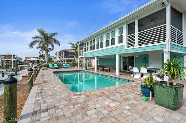360 Bayland Rd, Fort Myers Beach, FL 33931 - pool with a ceiling fan, an outdoor living space, and a patio area