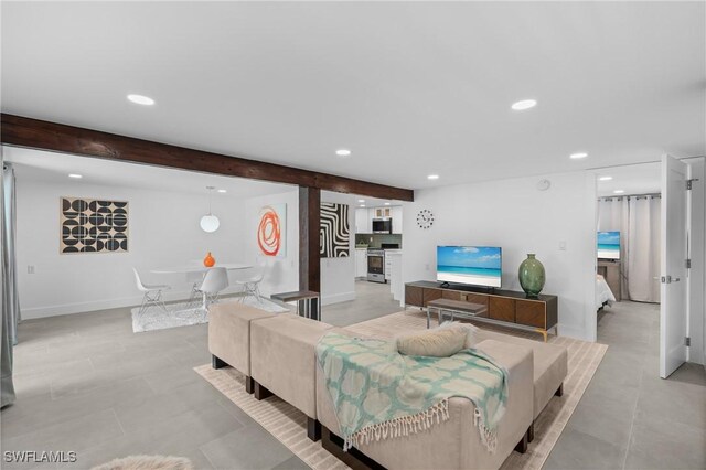 360 Bayland Rd, Fort Myers Beach, FL 33931 - living area featuring baseboards, beam ceiling, and recessed lighting