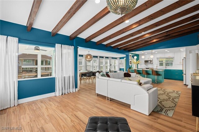 360 Bayland Rd, Fort Myers Beach, FL 33931 - living room with vaulted ceiling with beams, ceiling fan, and light wood finished floors