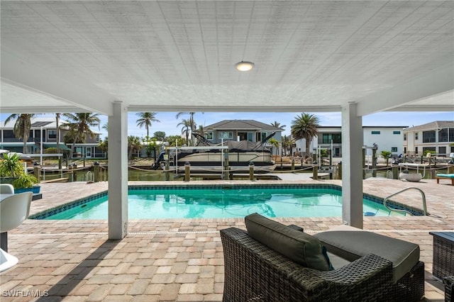 360 Bayland Rd, Fort Myers Beach, FL 33931 - pool with a patio, a boat dock, and boat lift