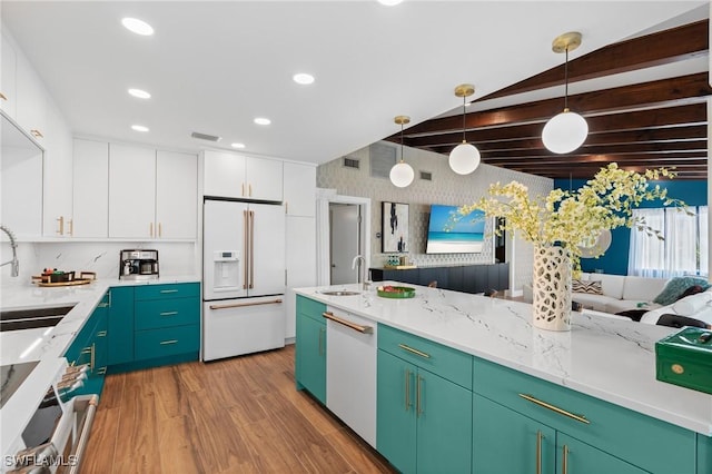 360 Bayland Rd, Fort Myers Beach, FL 33931 - kitchen featuring white cabinets, a sink, light wood finished floors, and white appliances