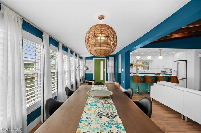 360 Bayland Rd, Fort Myers Beach, FL 33931 - dining room featuring wood finished floors