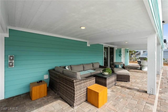 360 Bayland Rd, Fort Myers Beach, FL 33931 - view of patio featuring an outdoor living space