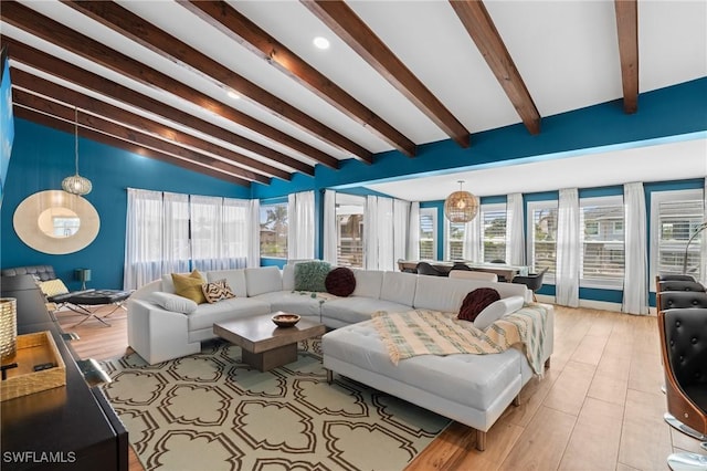 360 Bayland Rd, Fort Myers Beach, FL 33931 - living area with vaulted ceiling with beams, light wood finished floors, and a wealth of natural light