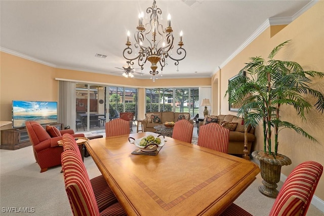 dining area with visible vents, carpet floors, a notable chandelier, and ornamental molding