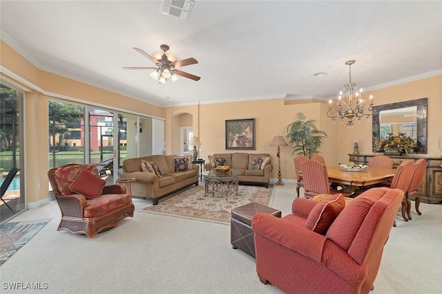 living room featuring visible vents, plenty of natural light, ceiling fan with notable chandelier, and carpet floors