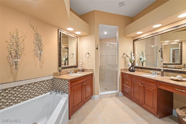 full bathroom with visible vents, a stall shower, and a sink