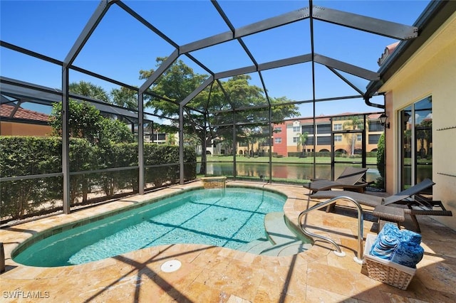 outdoor pool with glass enclosure and a patio area