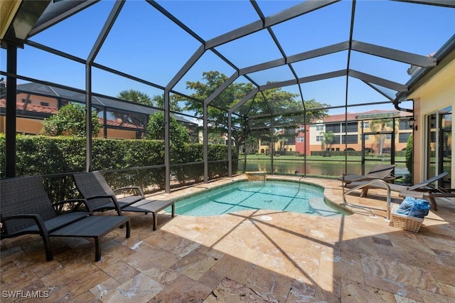 outdoor pool featuring a lanai and a patio area