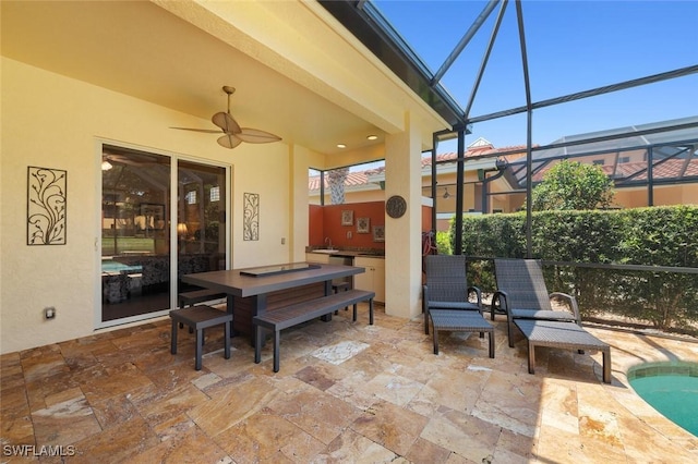 view of patio featuring a lanai, an outdoor pool, and ceiling fan