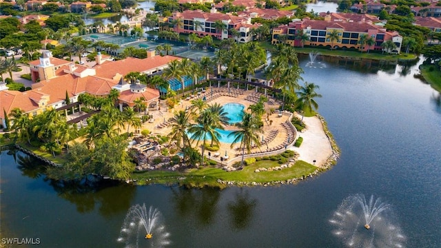 drone / aerial view featuring a residential view and a water view