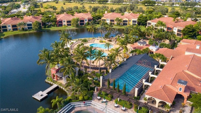 drone / aerial view featuring a water view and a residential view