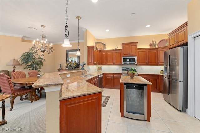 kitchen with light stone counters, brown cabinetry, a peninsula, stainless steel appliances, and wine cooler
