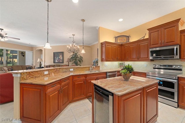 kitchen with beverage cooler, open floor plan, a peninsula, stainless steel appliances, and a sink