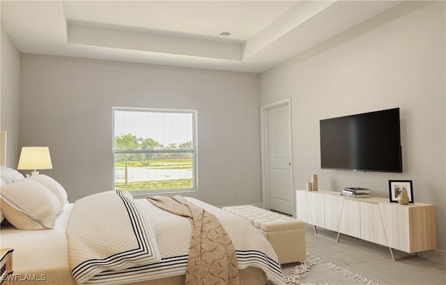 202 NE 25th St, Cape Coral, FL 33909 - bedroom featuring light tile patterned floors and a tray ceiling
