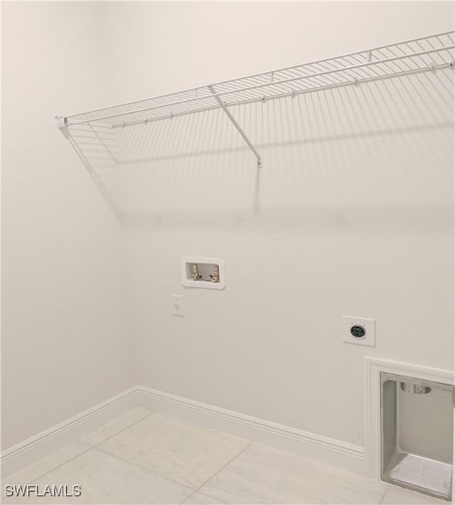 202 NE 25th St, Cape Coral, FL 33909 - clothes washing area featuring electric dryer hookup, baseboards, hookup for a washing machine, and laundry area