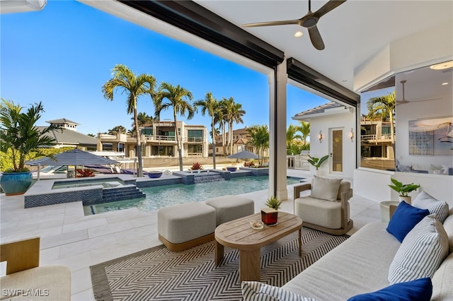 exterior space with outdoor lounge area, a pool with connected hot tub, a patio, and ceiling fan