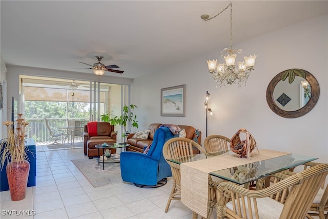 dining room featuring light tile patterned floors and ceiling fan with notable chandelier