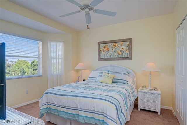 bedroom featuring baseboards, carpet flooring, and ceiling fan