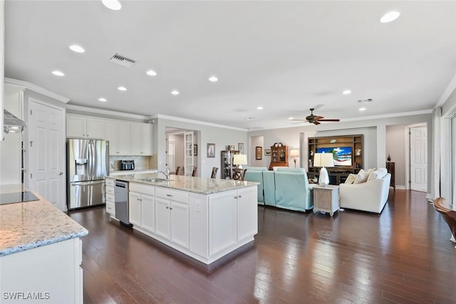 kitchen with recessed lighting, stainless steel appliances, visible vents, a ceiling fan, and ornamental molding