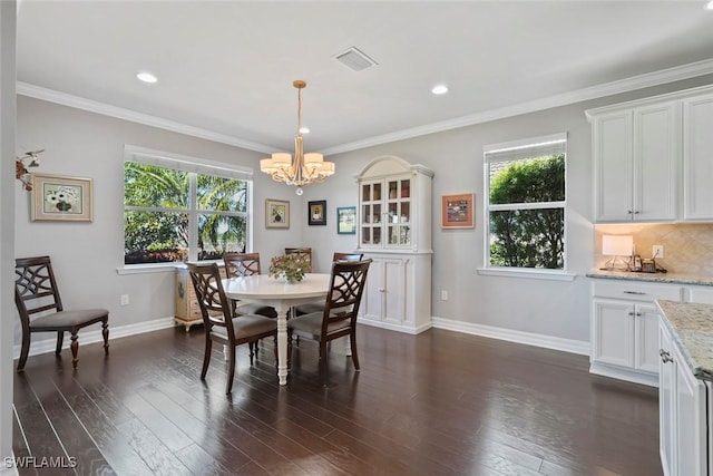 dining area featuring baseboards, a healthy amount of sunlight, a chandelier, and dark wood-style floors