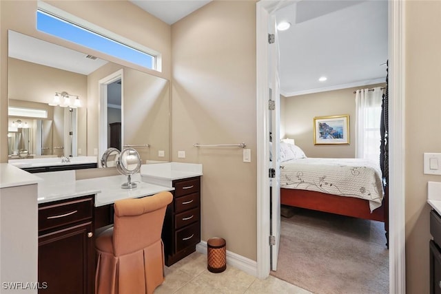 full bathroom featuring baseboards, ensuite bathroom, vanity, and tile patterned floors