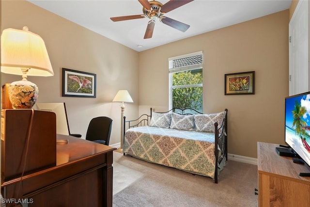 bedroom with baseboards, carpet flooring, and ceiling fan
