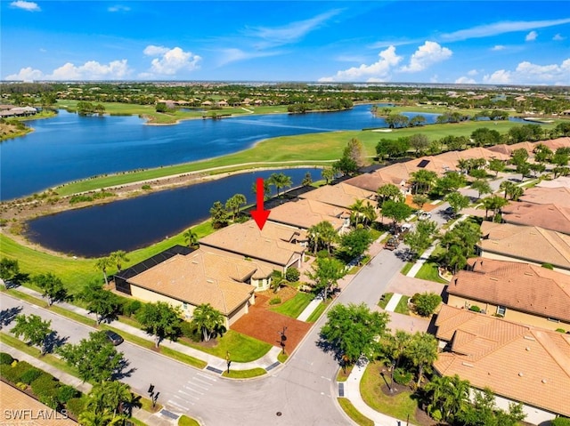 bird's eye view featuring view of golf course, a residential view, and a water view