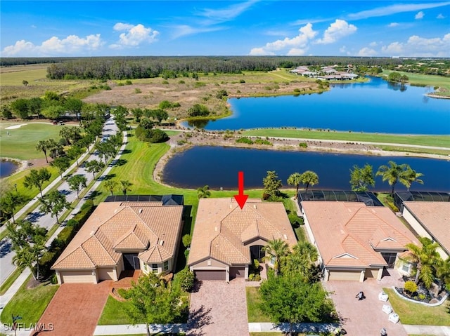 aerial view featuring view of golf course and a water view